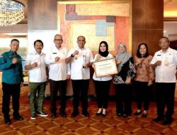Langkat Raih Penghargaan Kabupaten Terbaik dalam Perluasan Akses Keuangan 